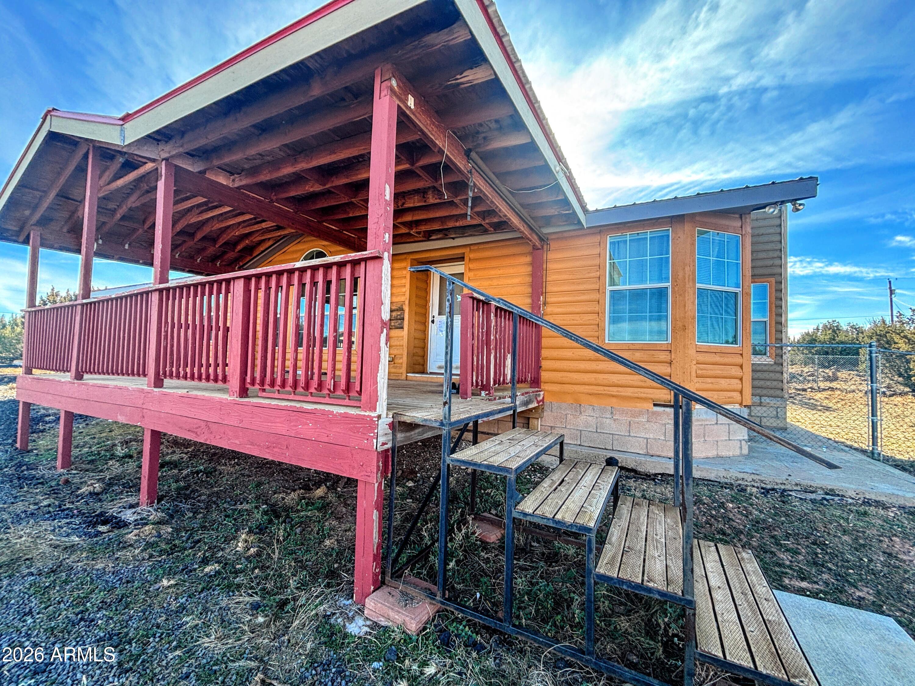 111 County Road, Unit 8015 Show Low, AZ 85901 - Photo 34 of 34 a view of backyard with deck and wooden fence