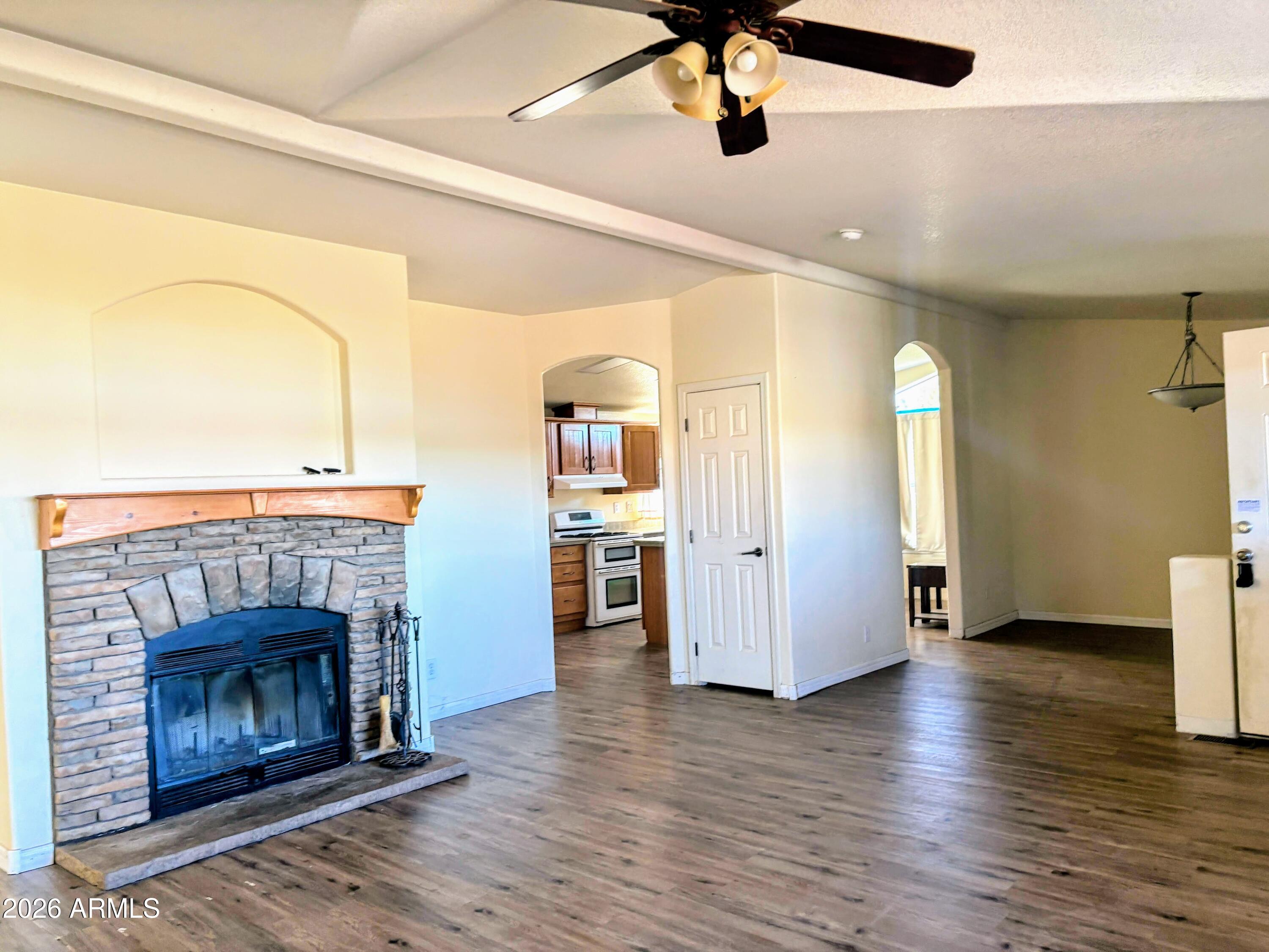 111 County Road, Unit 8015 Show Low, AZ 85901 - Photo 6 of 34 a view of a living room a fireplace with wooden floor