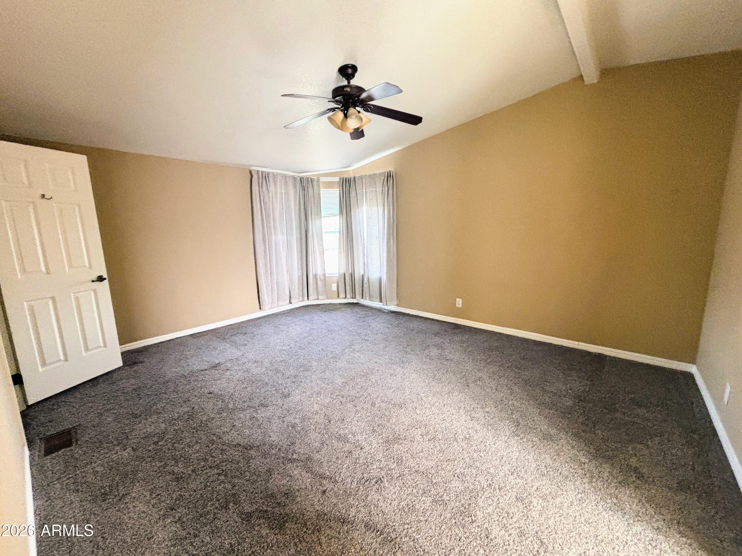 111 County Road, Unit 8015 Show Low, AZ 85901 - Photo 9 of 34 a view of an empty room with a window