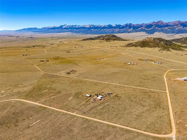 a view of an ocean and a mountain