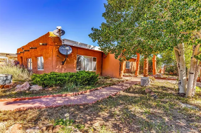 a view of a house with a tree