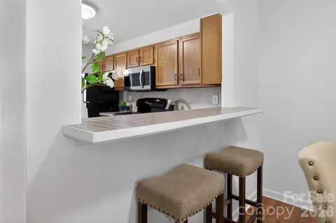 a kitchen with stainless steel appliances a sink and a cabinets