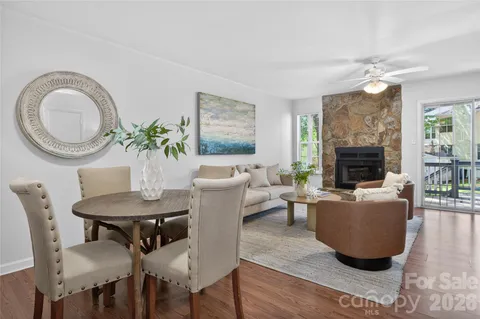 a living room with furniture a fireplace and a fireplace
