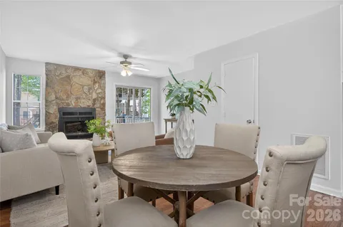a living room with furniture a window and a table