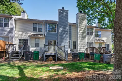 a view of a house with a yard and sitting area