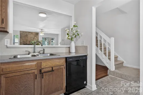 a kitchen with a sink and cabinets