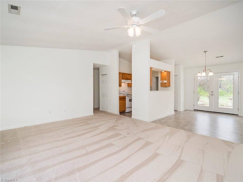 3621 Country Ridge Road Greensboro, NC 27405 - Photo 8 of 24 Living room open to dining area.