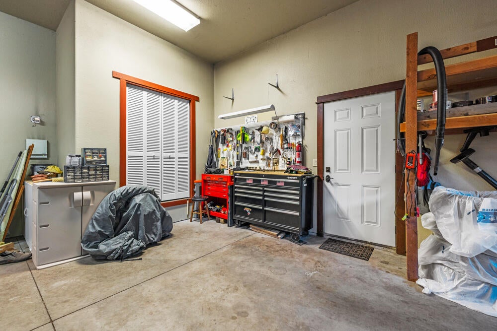 6012 Cooper's Hawk Road Klamath Falls, OR 97601 - Photo 58 of 58 Garage - door to outside and accordion doors on furnace and water heater space
