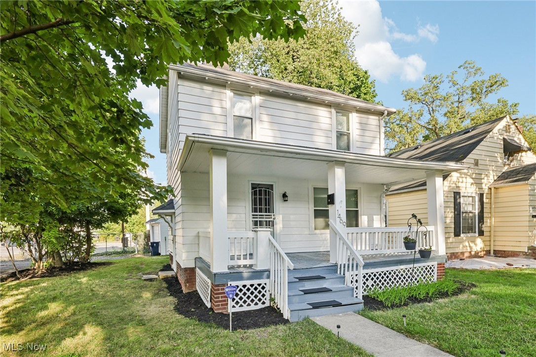 1469 South Noble Road Cleveland, OH 44121 - Photo 2 of 29 Traditional style home with a front lawn and covered porch