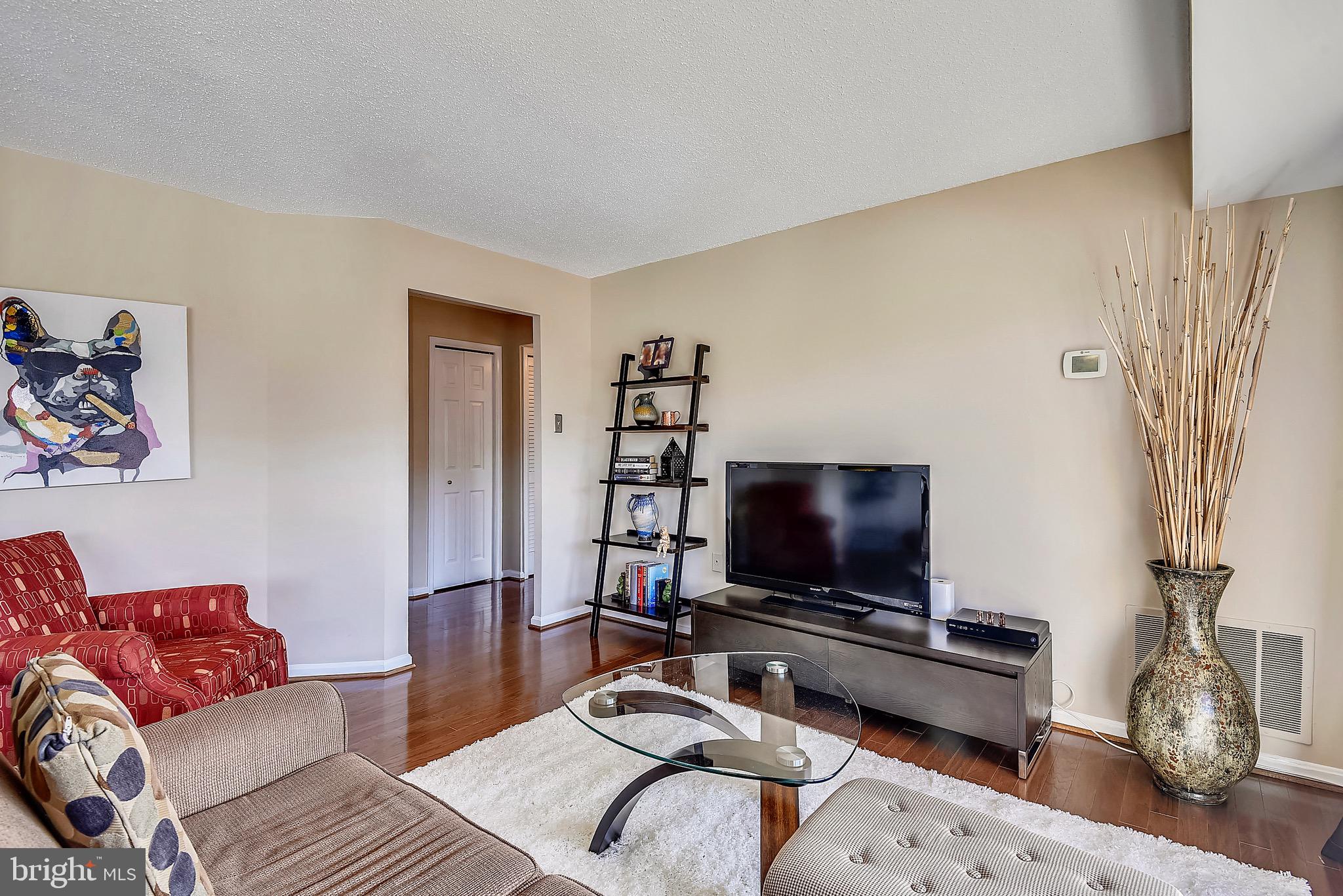 1301 North Courthouse Road, Unit 1503 Arlington, VA 22201 - Photo 13 of 26 a living room with furniture and a flat screen tv