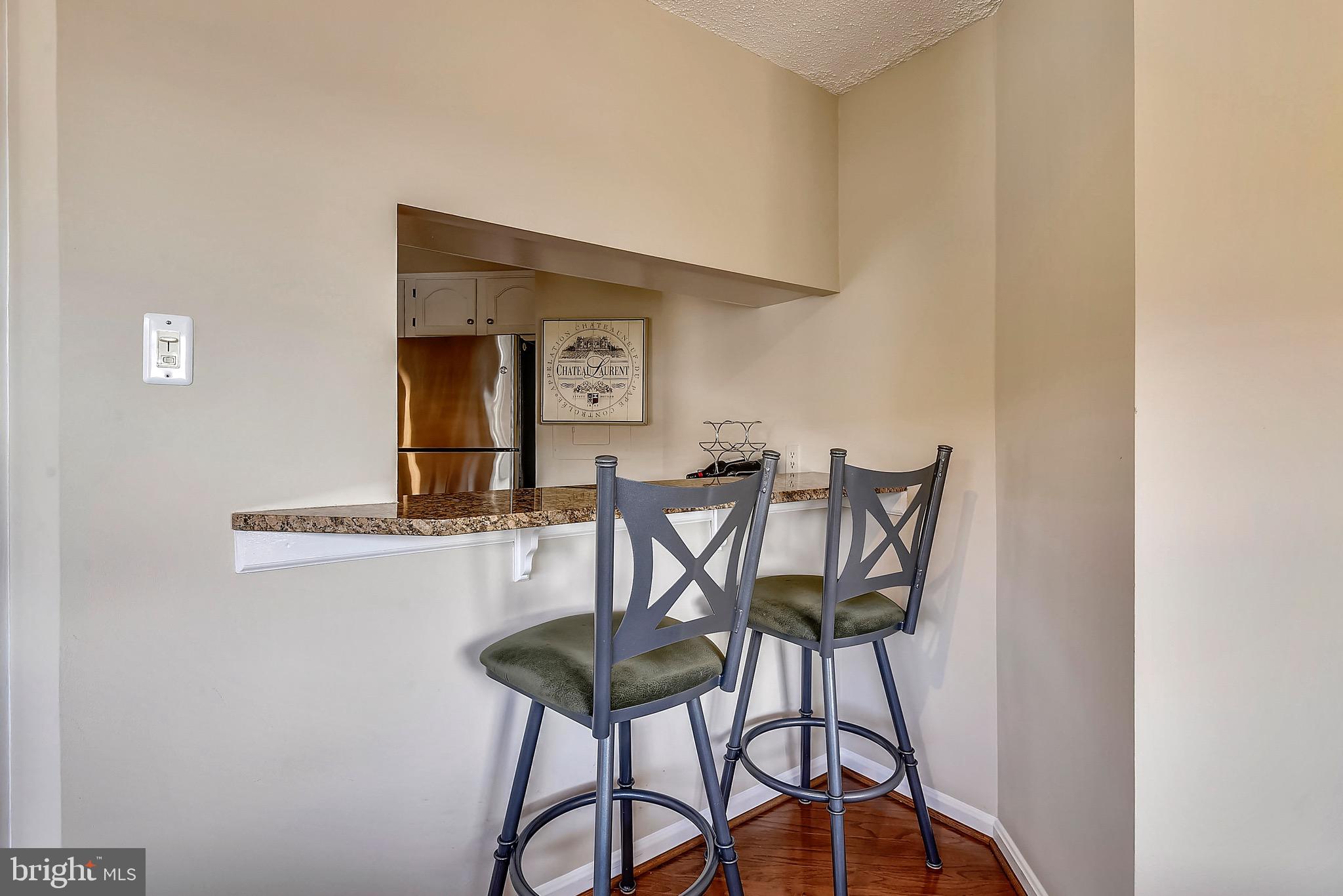 1301 North Courthouse Road, Unit 1503 Arlington, VA 22201 - Photo 14 of 26 a view of a dining room with furniture and a potted plant