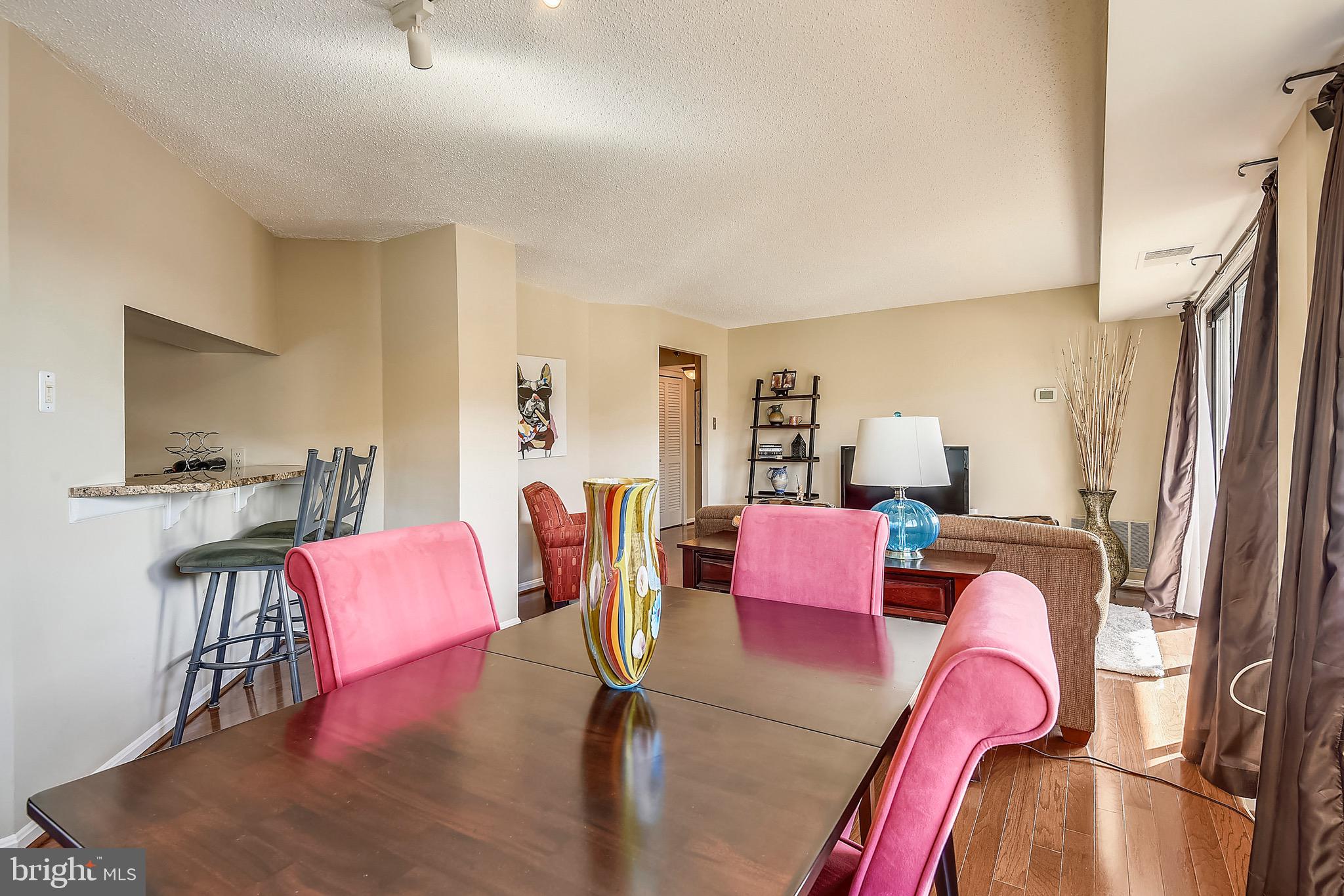 1301 North Courthouse Road, Unit 1503 Arlington, VA 22201 - Photo 5 of 26 a living room with furniture and a wooden floor