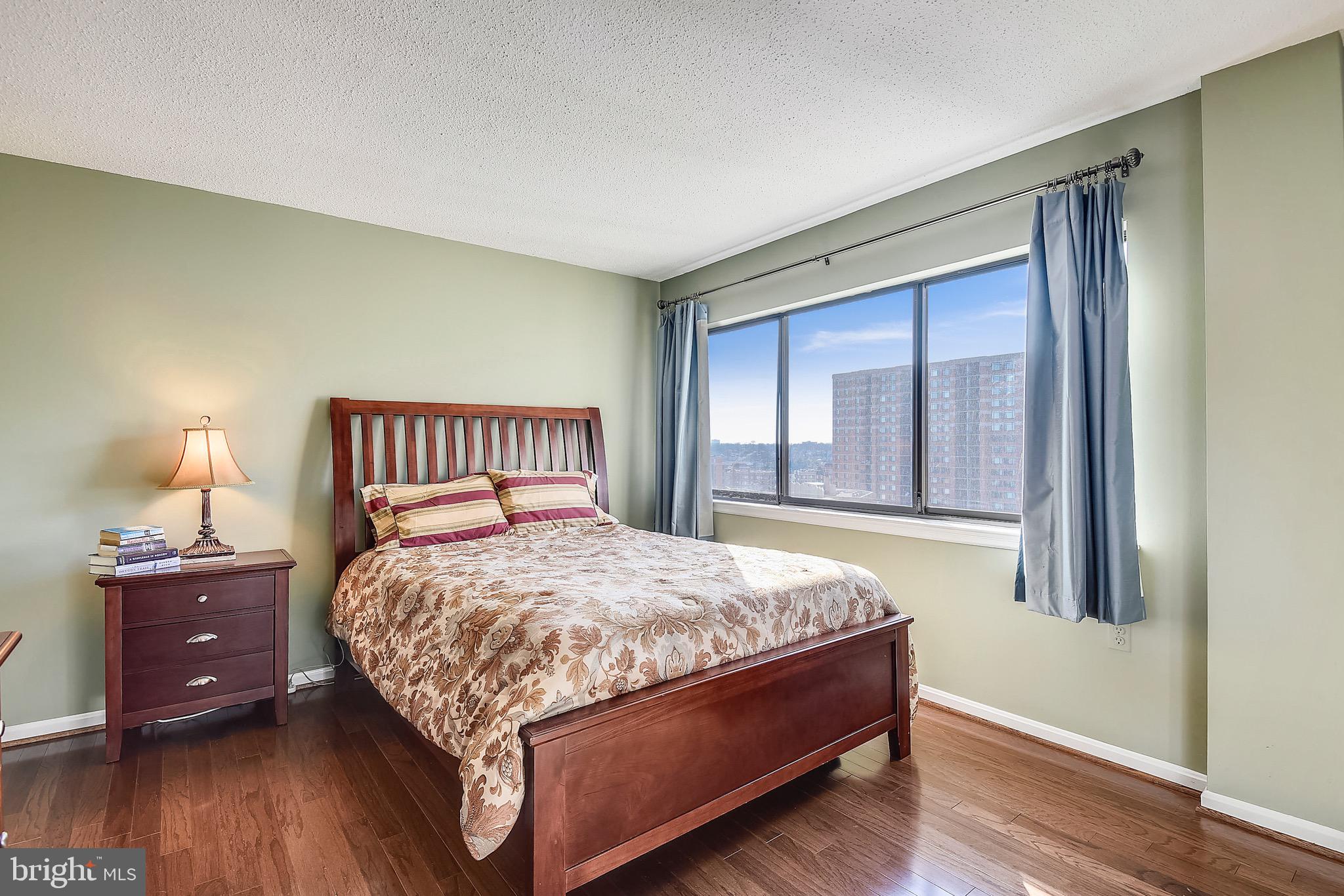 1301 North Courthouse Road, Unit 1503 Arlington, VA 22201 - Photo 6 of 26 a bedroom with a bed and a window
