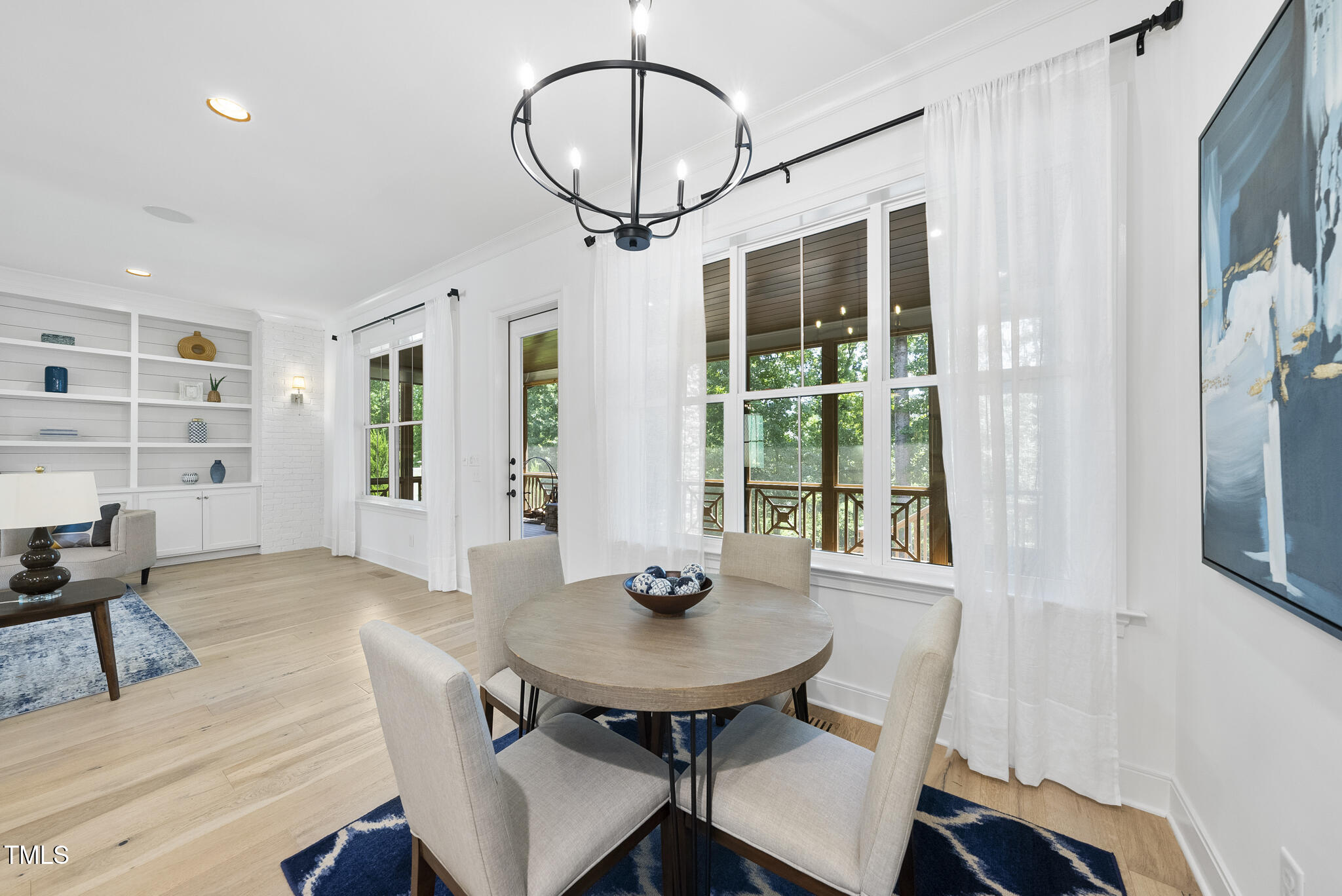 2073 Amalfi Place Apex, NC 27502 - Photo 16 of 40 a view of a dining room with furniture and window