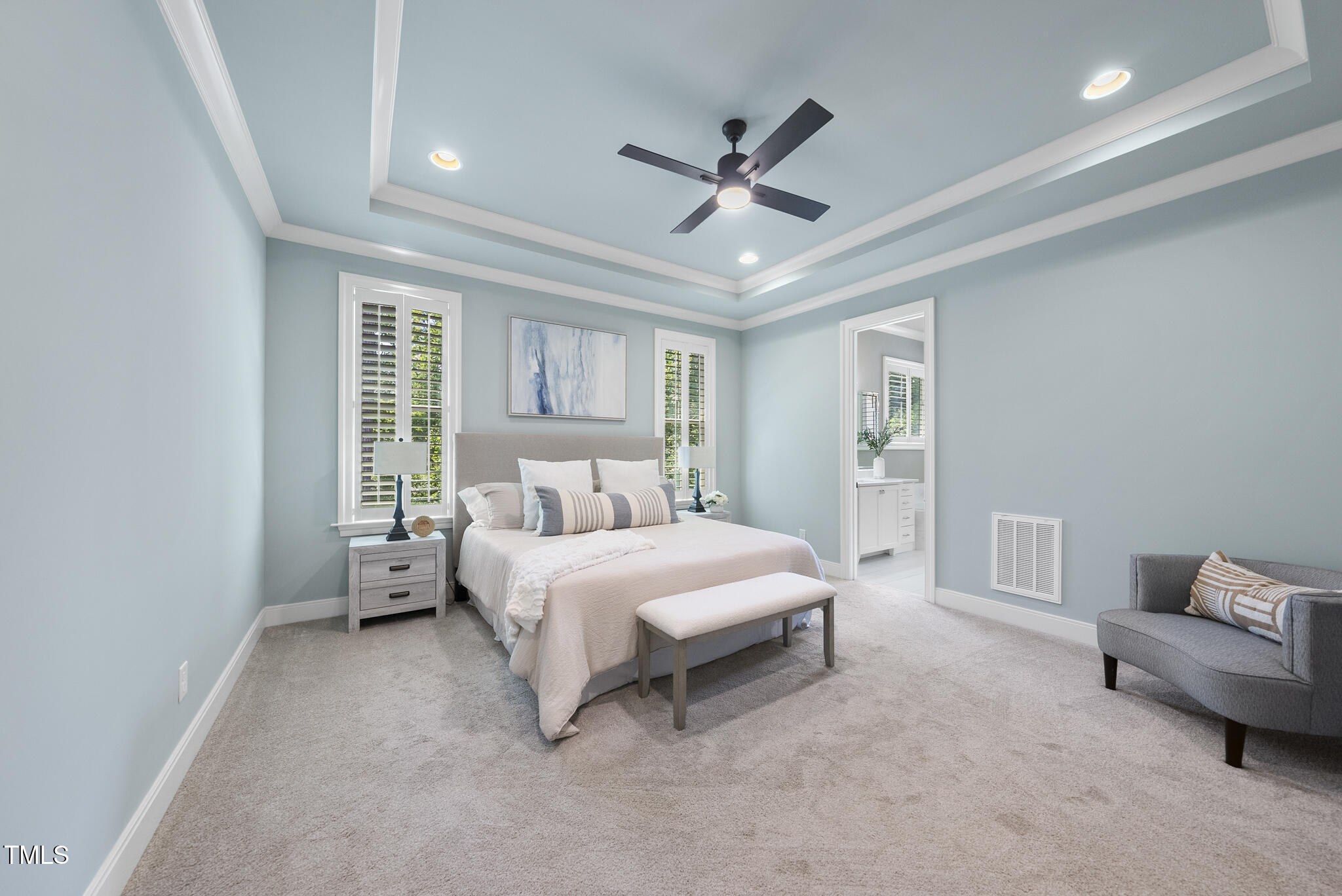 2073 Amalfi Place Apex, NC 27502 - Photo 18 of 40 a bedroom with a bed couch and window