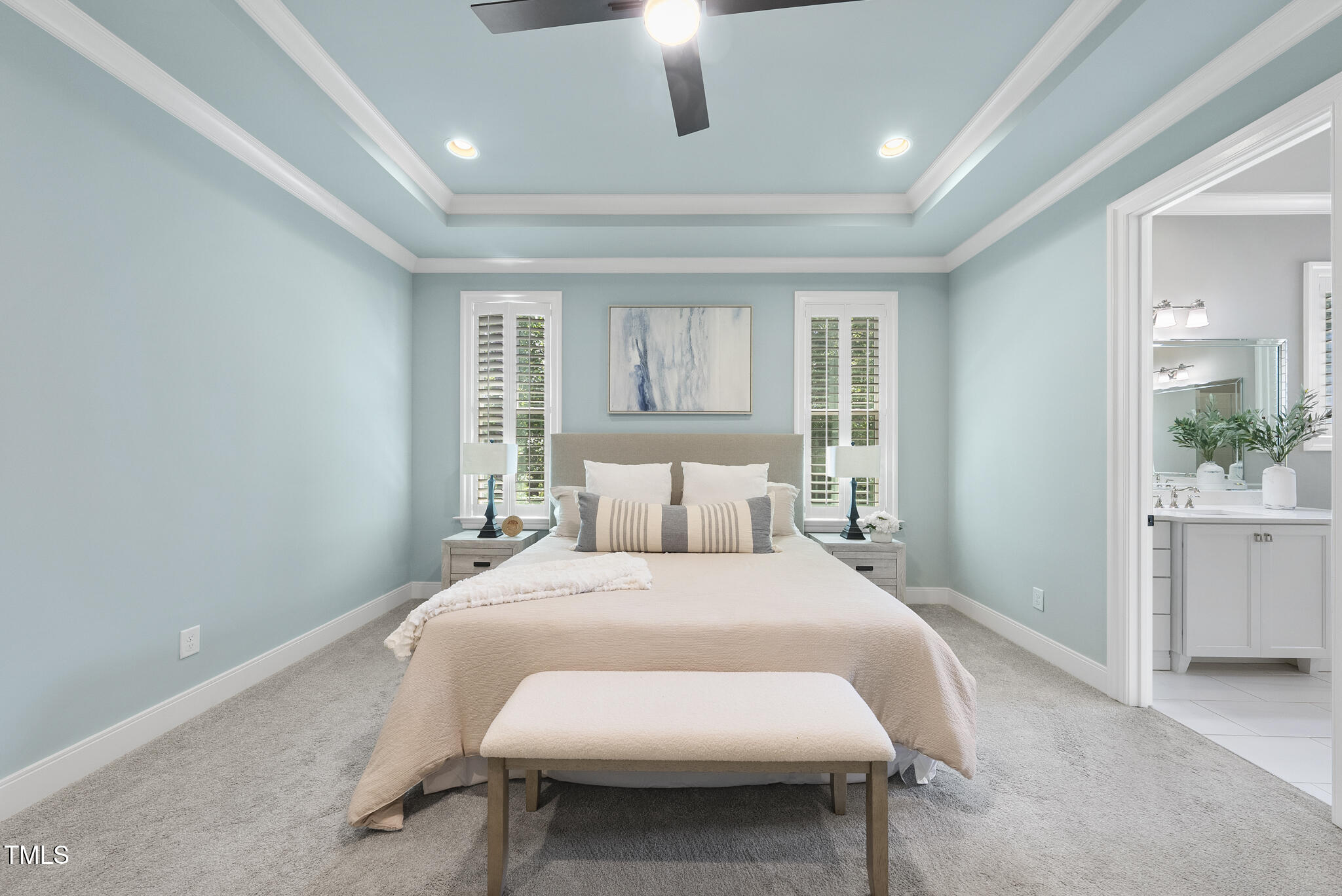 2073 Amalfi Place Apex, NC 27502 - Photo 19 of 40 a bed room with a bed and a table