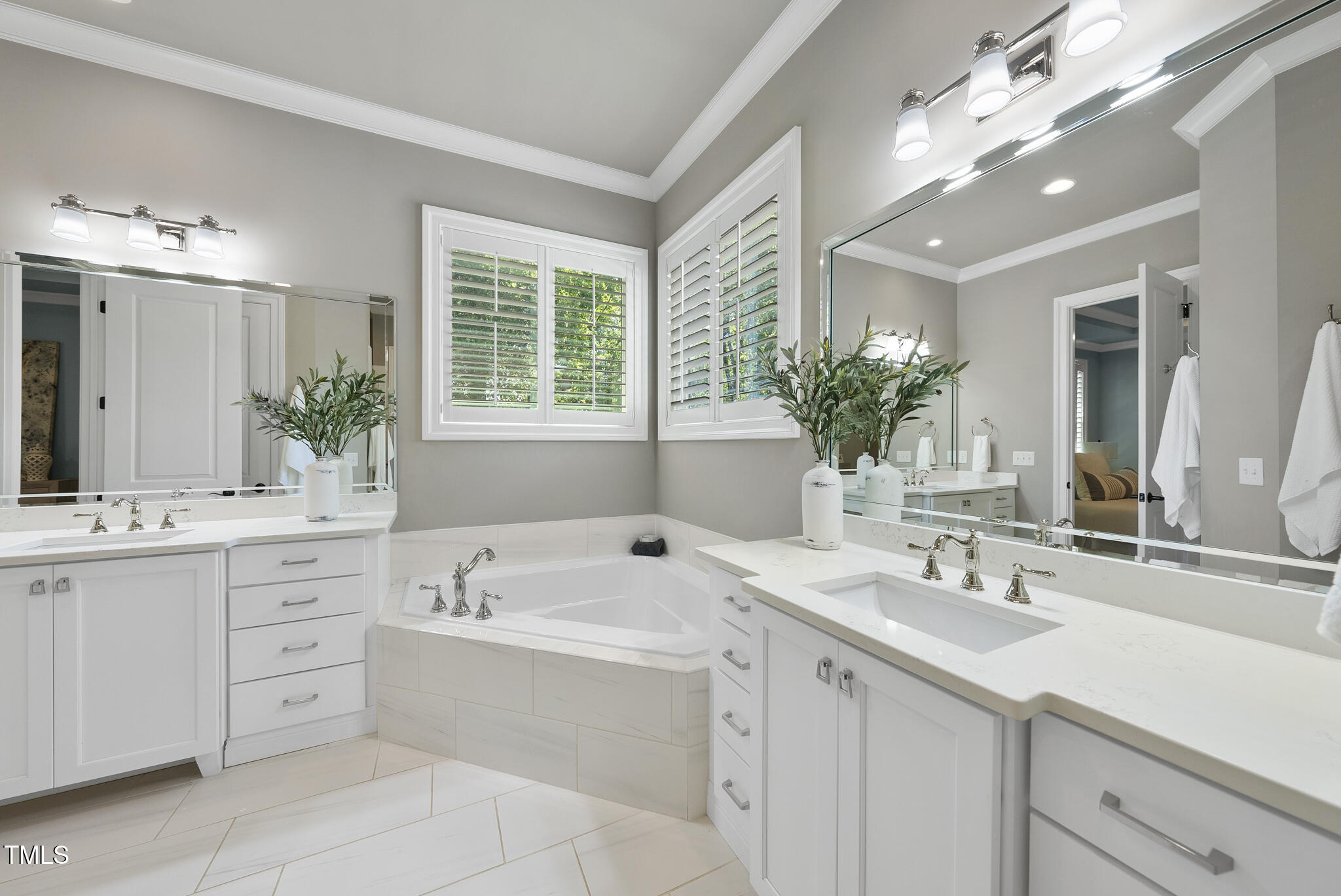 2073 Amalfi Place Apex, NC 27502 - Photo 22 of 40 a bathroom with a sink double vanity and a mirror