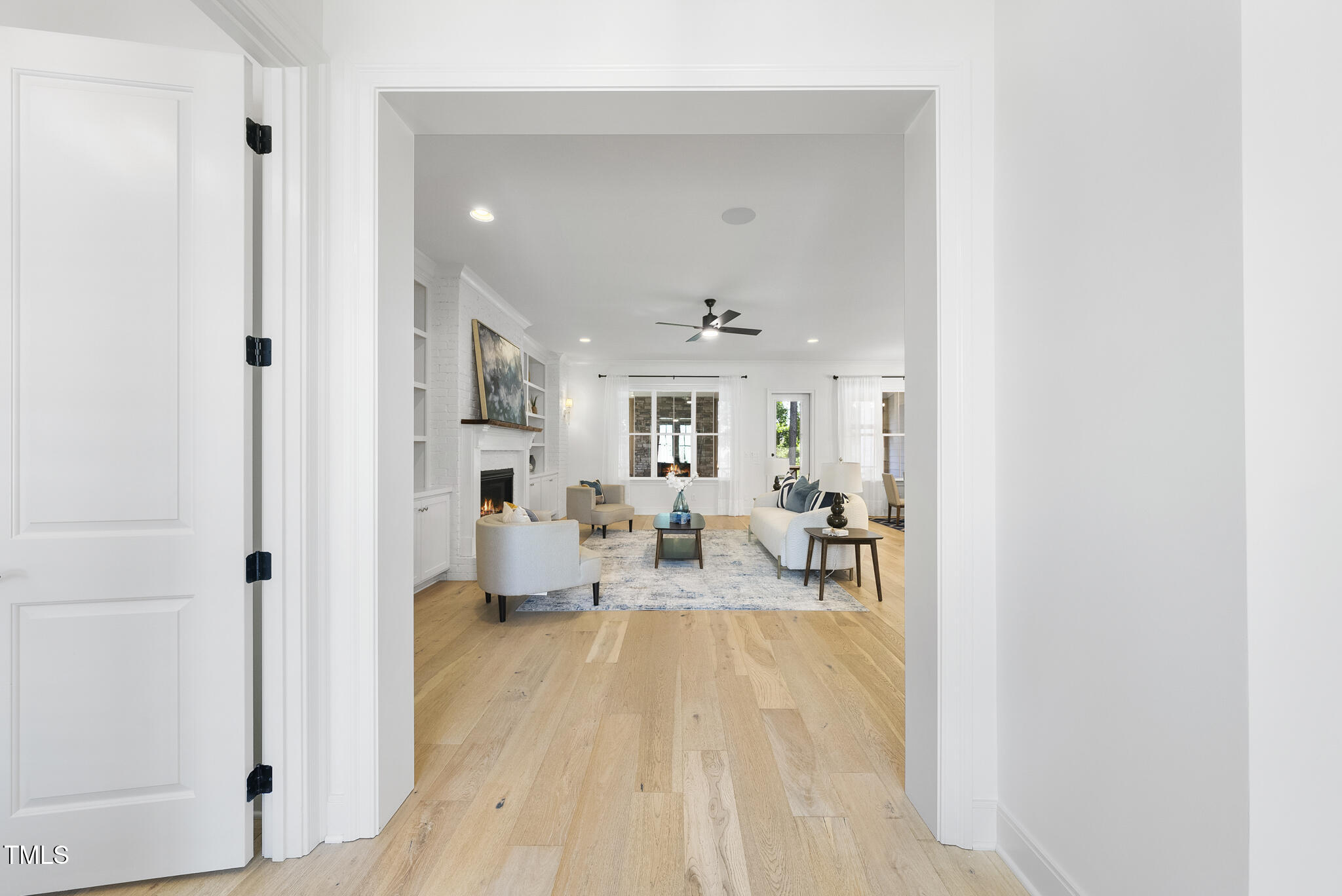2073 Amalfi Place Apex, NC 27502 - Photo 2 of 40 a living room with furniture and a table