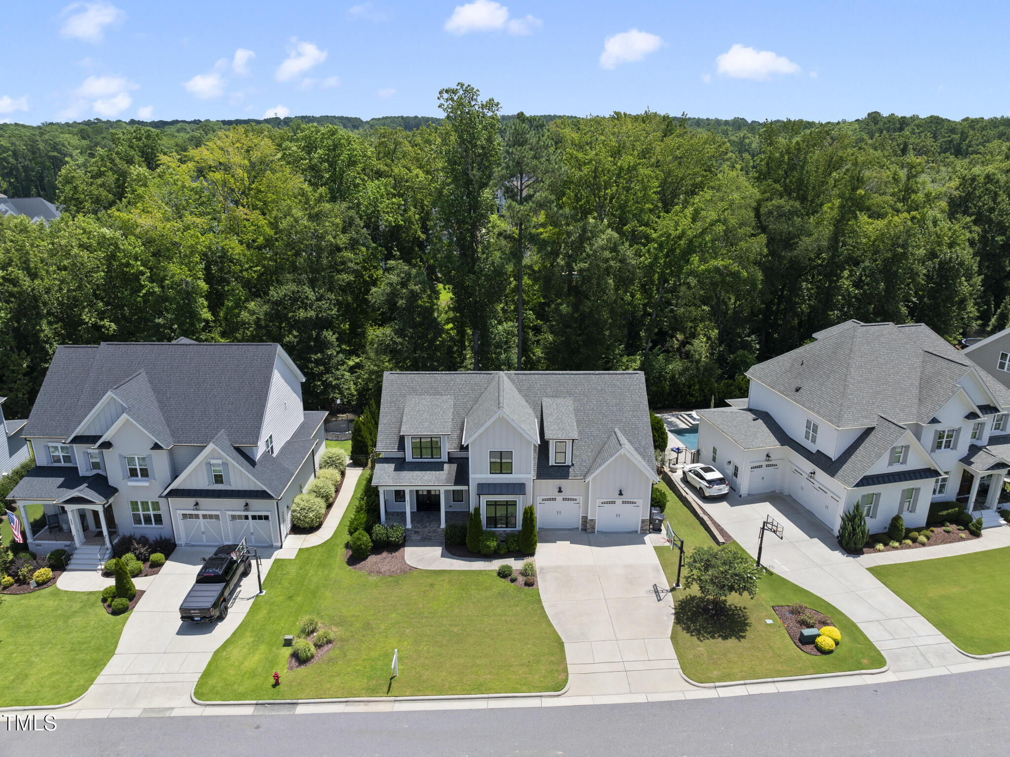 2073 Amalfi Place Apex, NC 27502 - Photo 29 of 40 an aerial view of a house with garden space and a patio