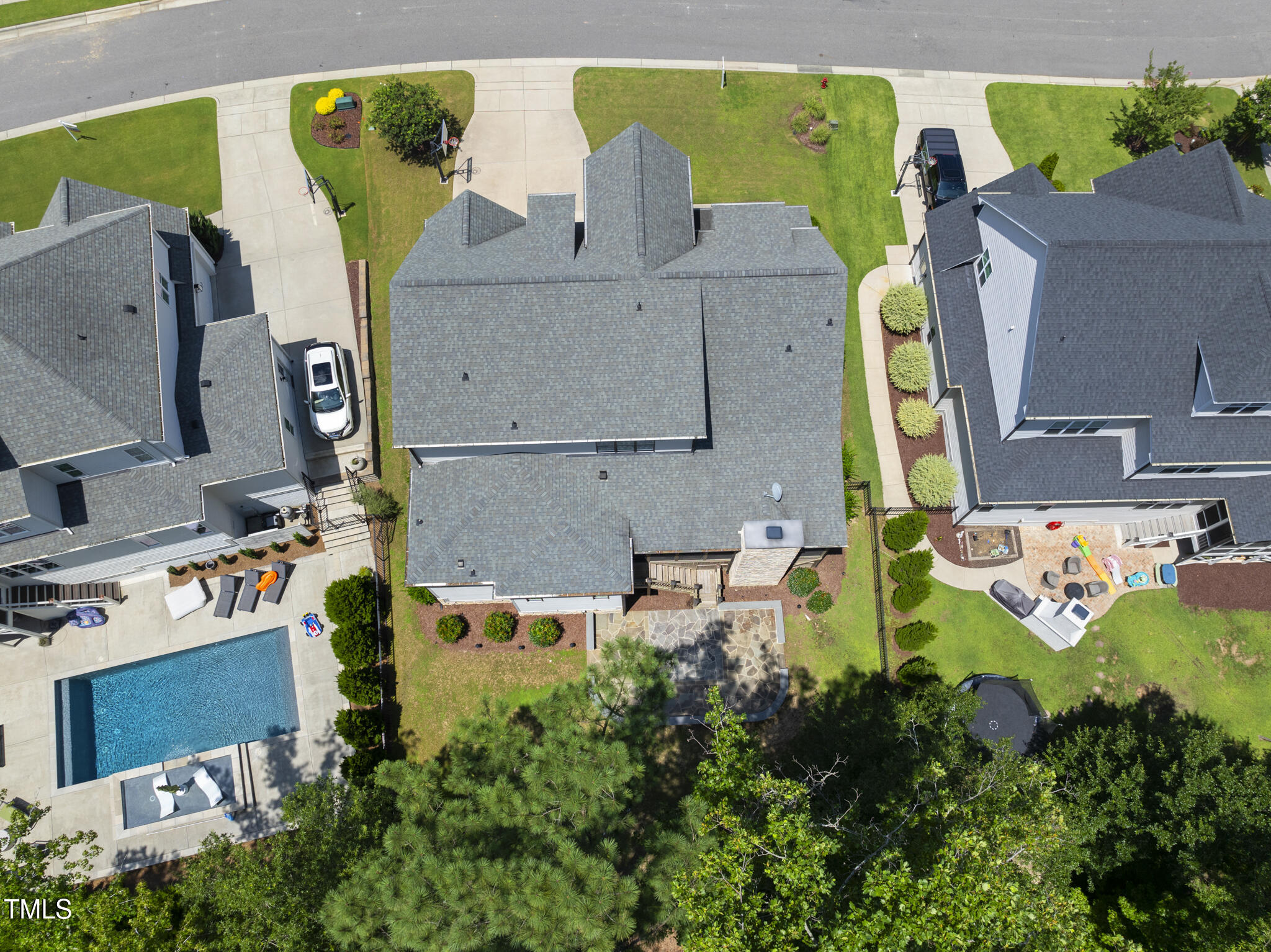 2073 Amalfi Place Apex, NC 27502 - Photo 31 of 40 an aerial view of a house with a swimming pool