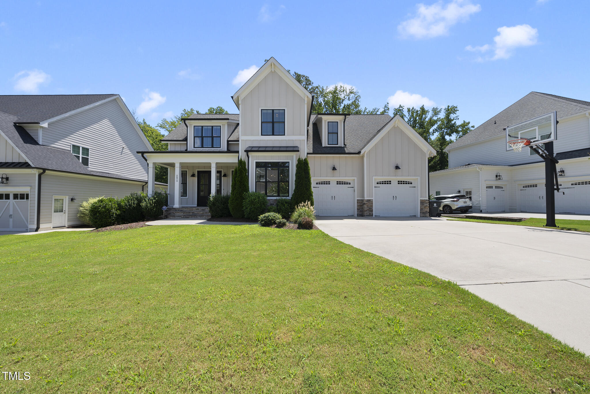 2073 Amalfi Place Apex, NC 27502 - Photo 32 of 40 a front view of a house with a yard and garage
