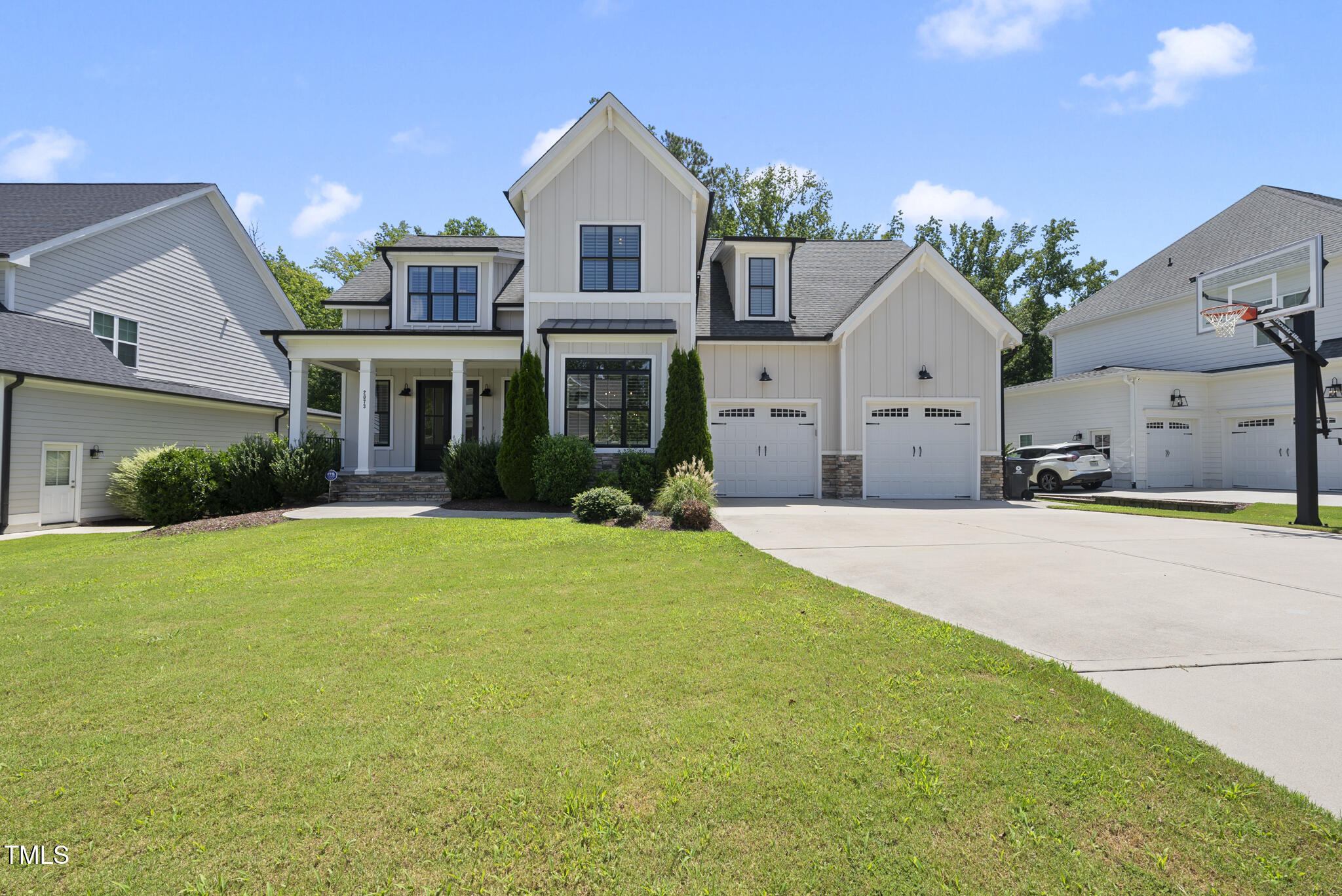 2073 Amalfi Place Apex, NC 27502 - Photo 33 of 40 a front view of a house with a yard and garage