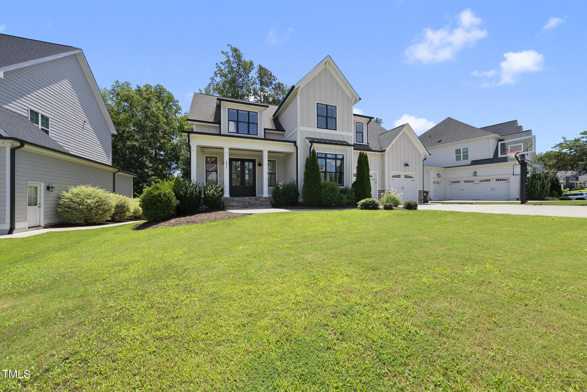 2073 Amalfi Place Apex, NC 27502 - Photo 35 of 40 a view of a house with a big yard and large trees