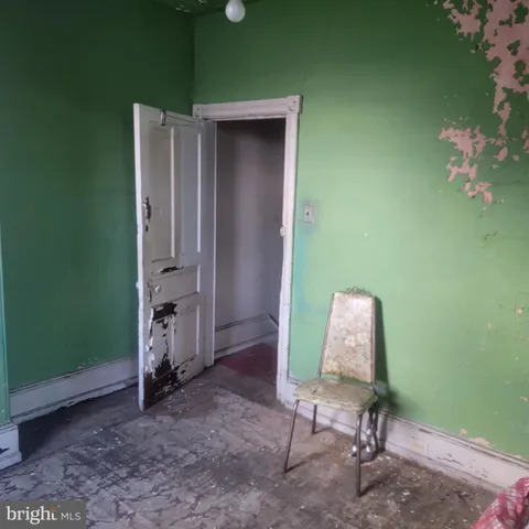 a room with furniture and a potted plant