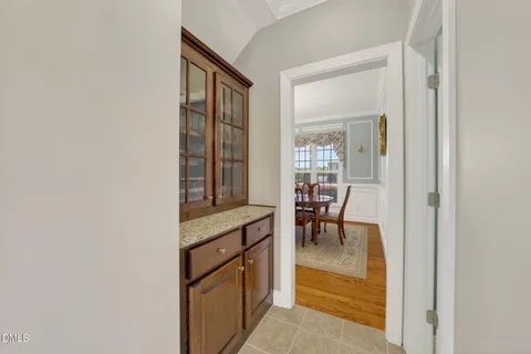 a bathroom with a double vanity sink mirror and shower