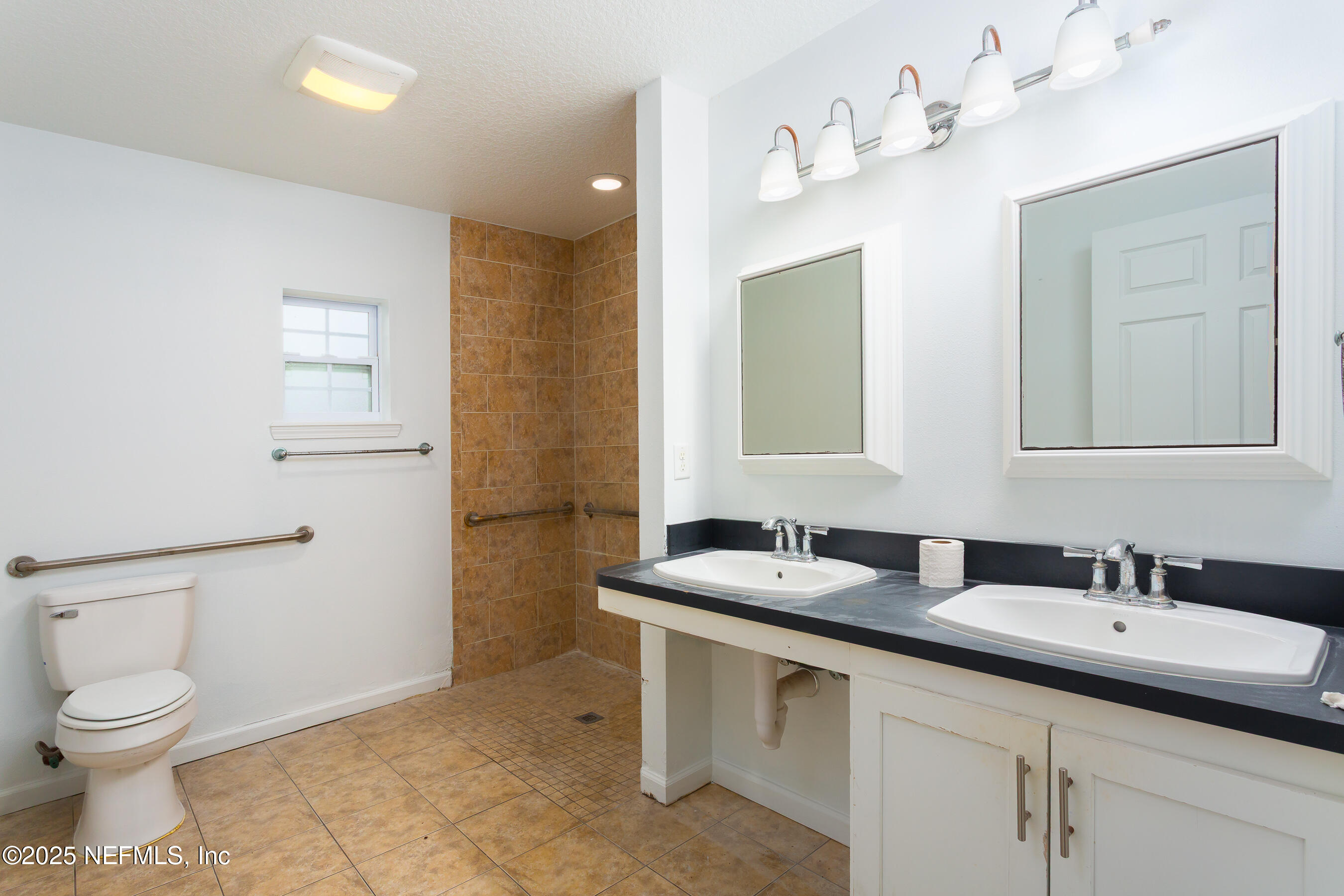 164 Carole Road Palatka, FL 32177 - Photo 19 of 32 a bathroom with a toilet sink and mirror
