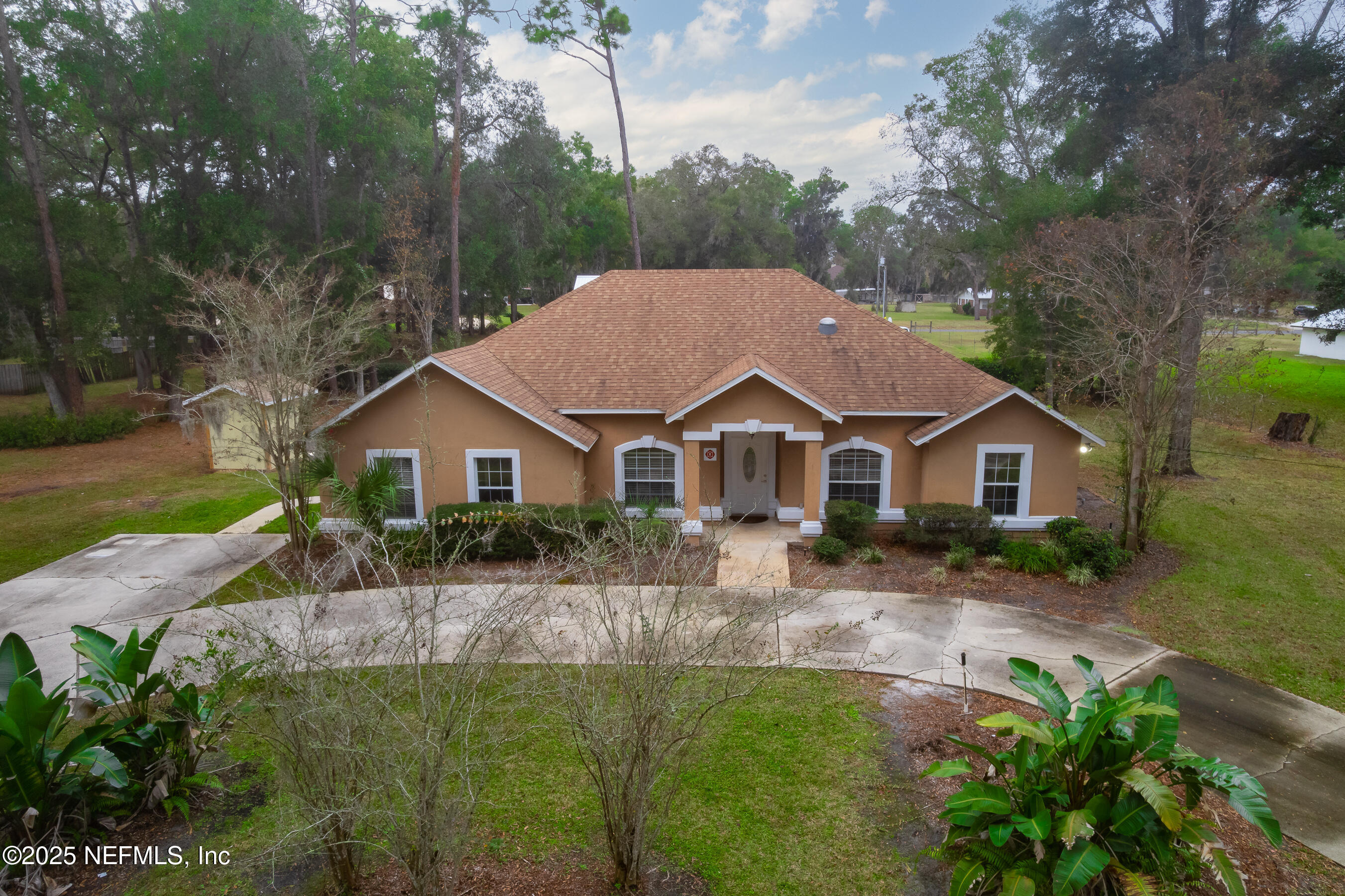 164 Carole Road Palatka, FL 32177 - Photo 2 of 32 a front view of a house with a garden