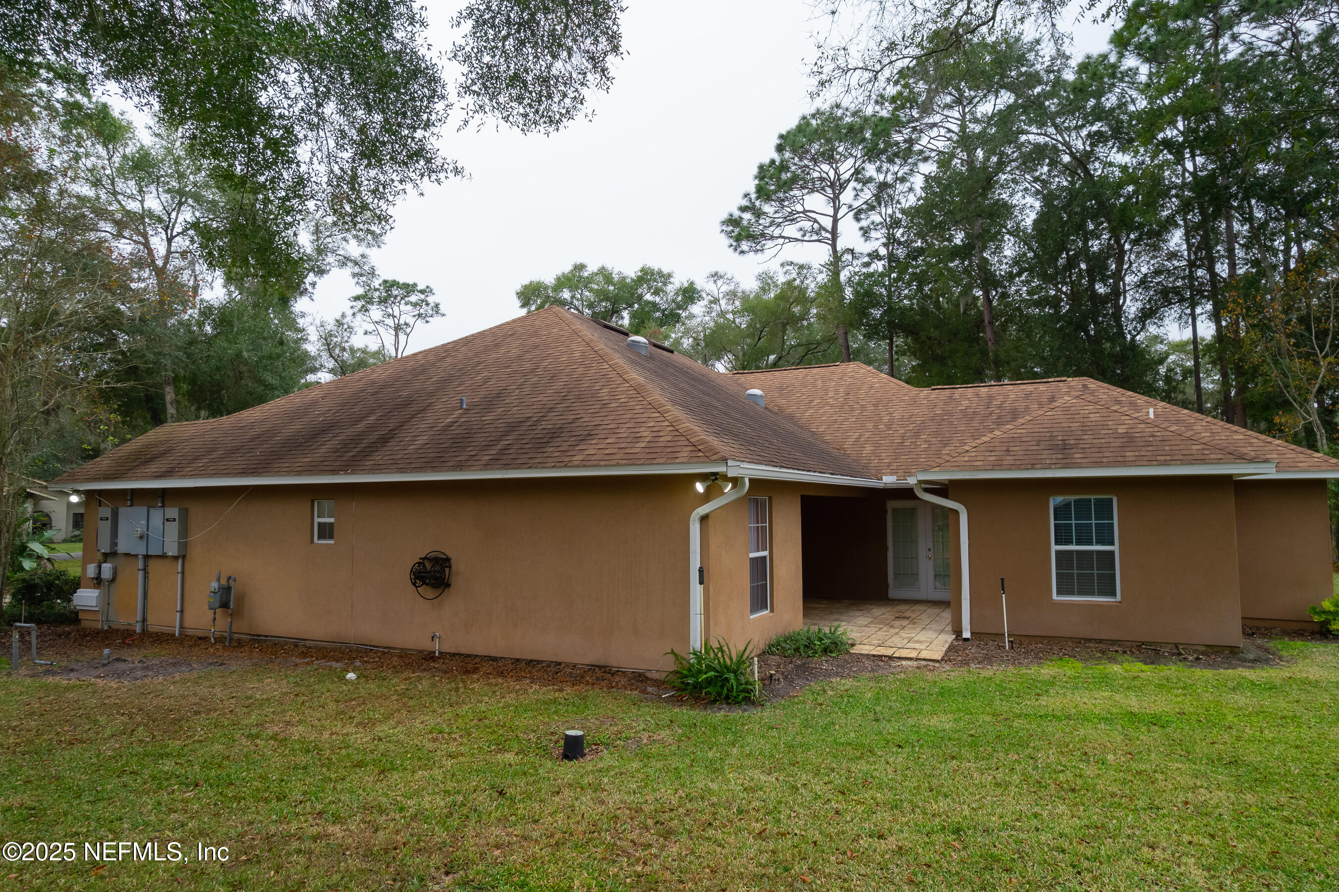164 Carole Road Palatka, FL 32177 - Photo 24 of 32 a view of a barn with big yard potted plants and large tree