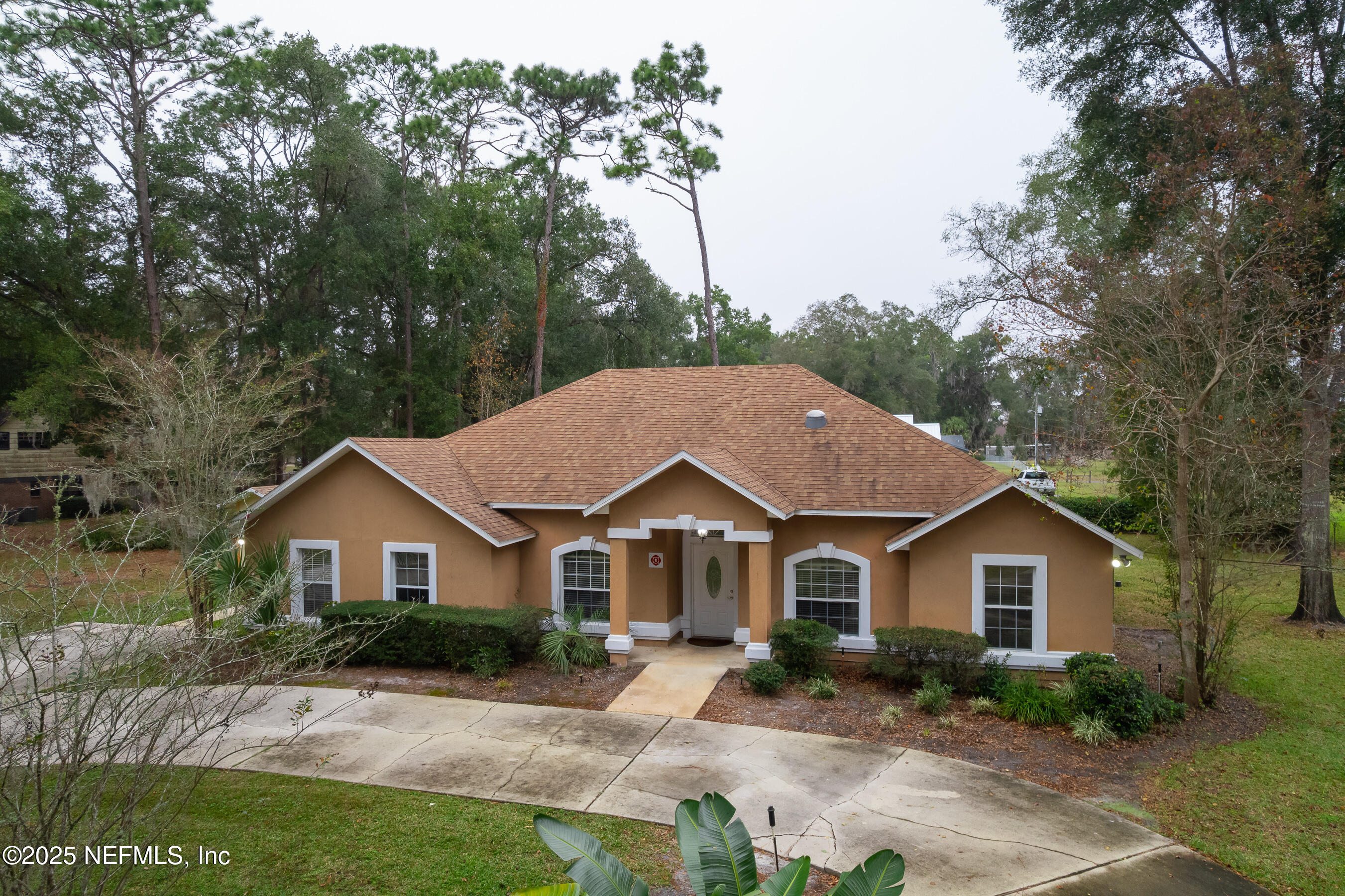 164 Carole Road Palatka, FL 32177 - Photo 25 of 32 a house with trees in the background