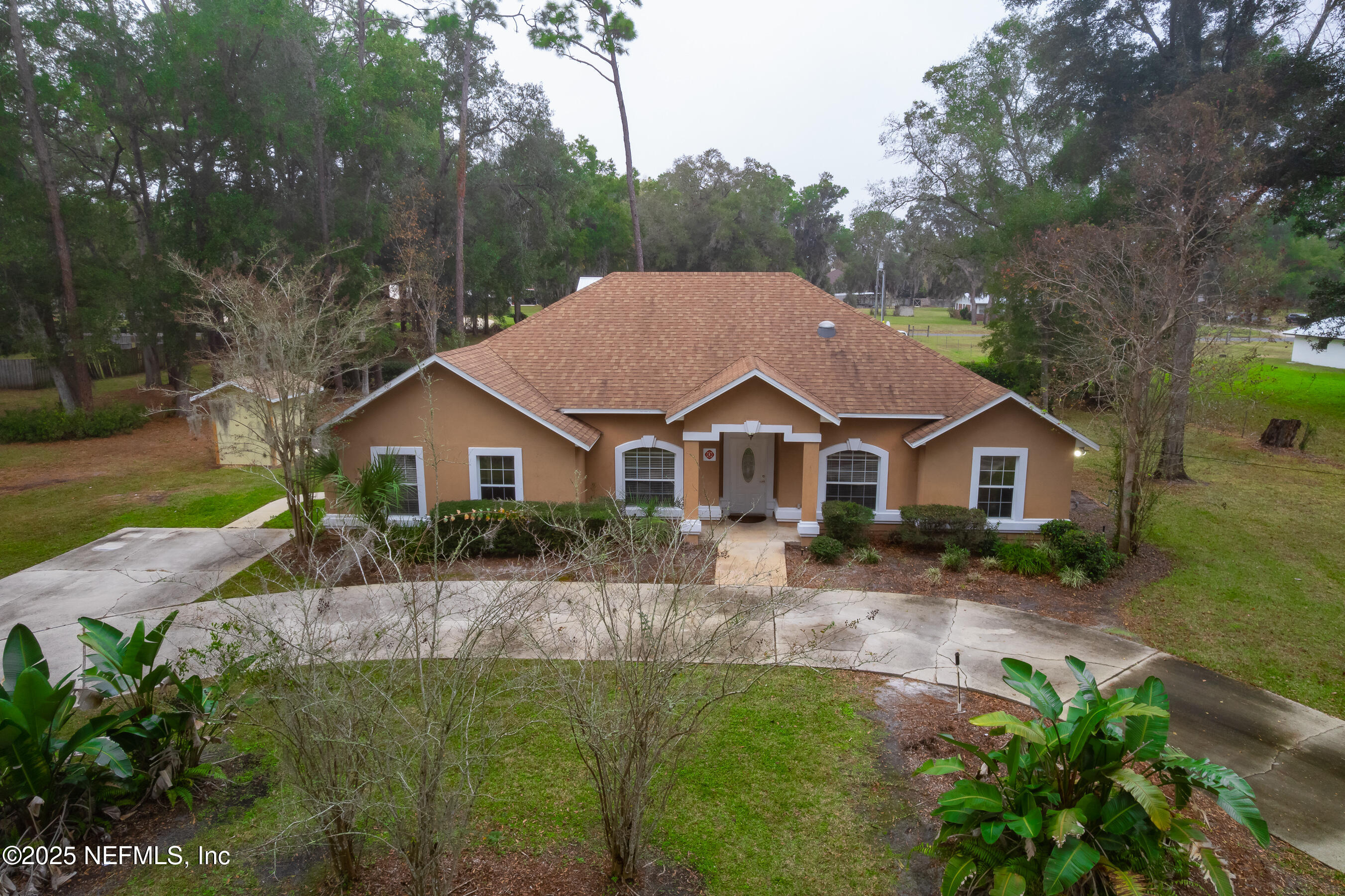 164 Carole Road Palatka, FL 32177 - Photo 27 of 32 a front view of a house with a garden