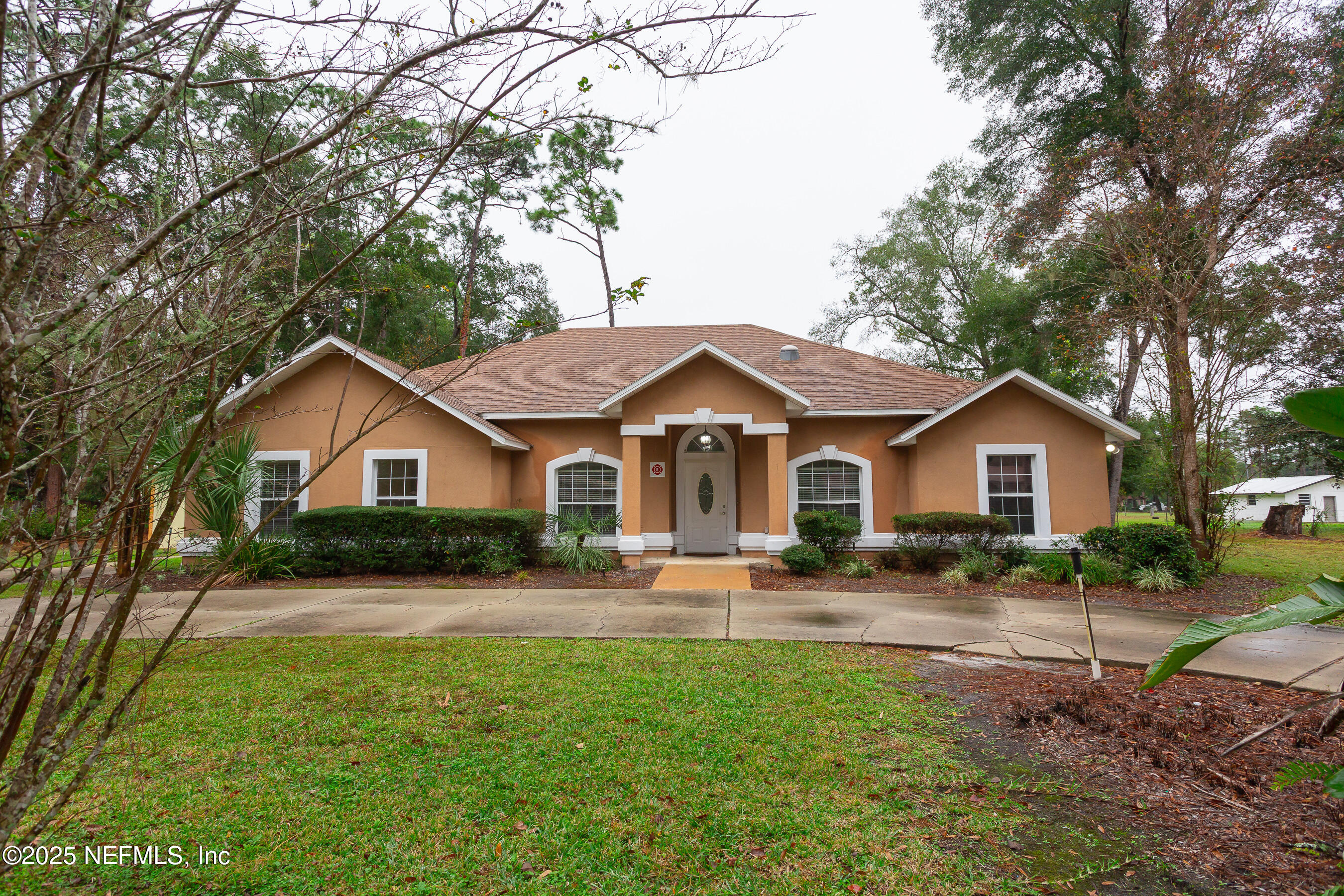 164 Carole Road Palatka, FL 32177 - Photo 30 of 32 a front view of a house with a yard and trees