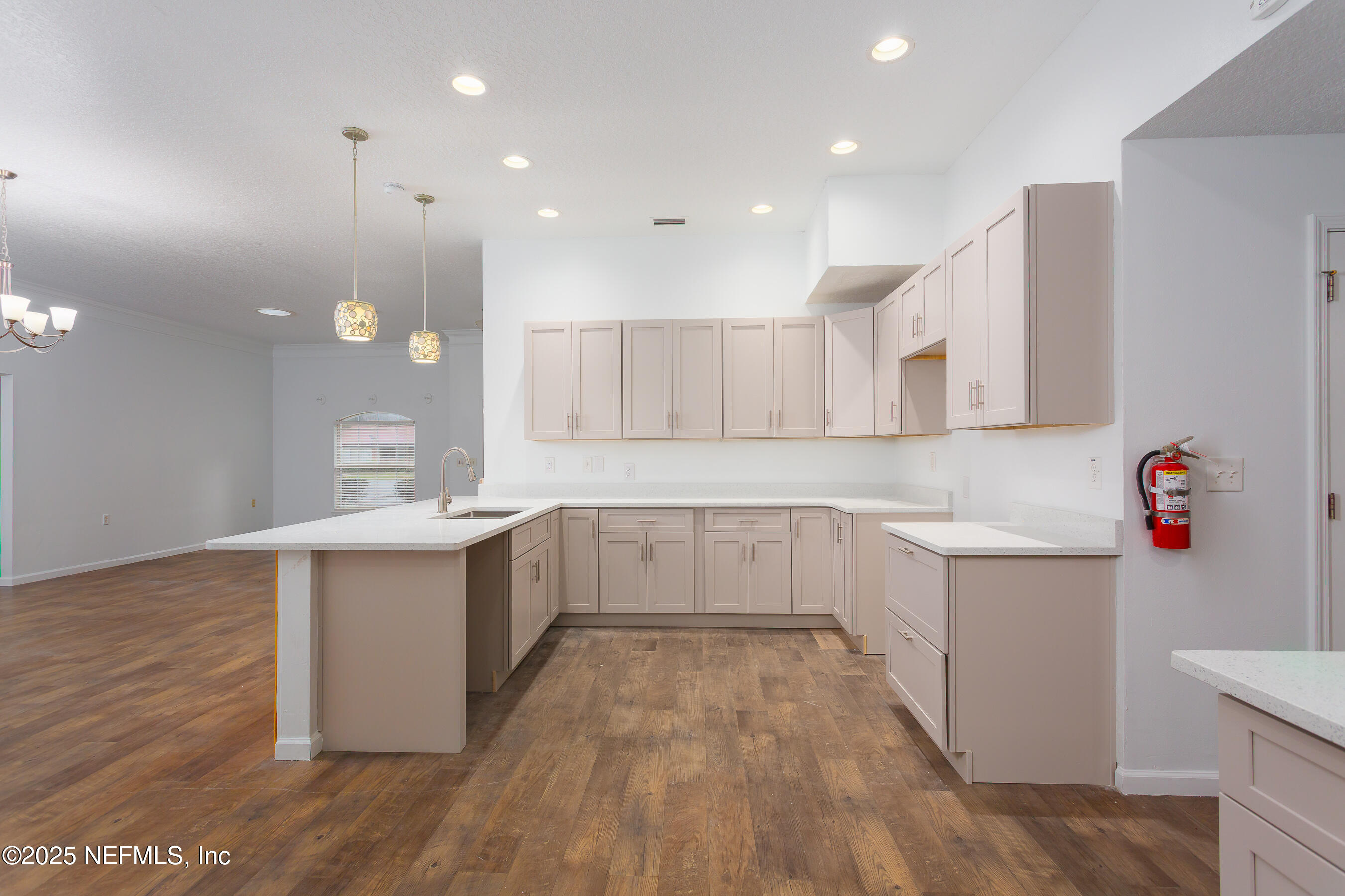 164 Carole Road Palatka, FL 32177 - Photo 6 of 32 a kitchen with a sink and wooden floor