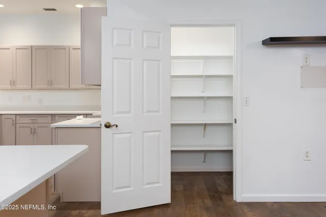 a bathroom with a sink toilet and a mirror