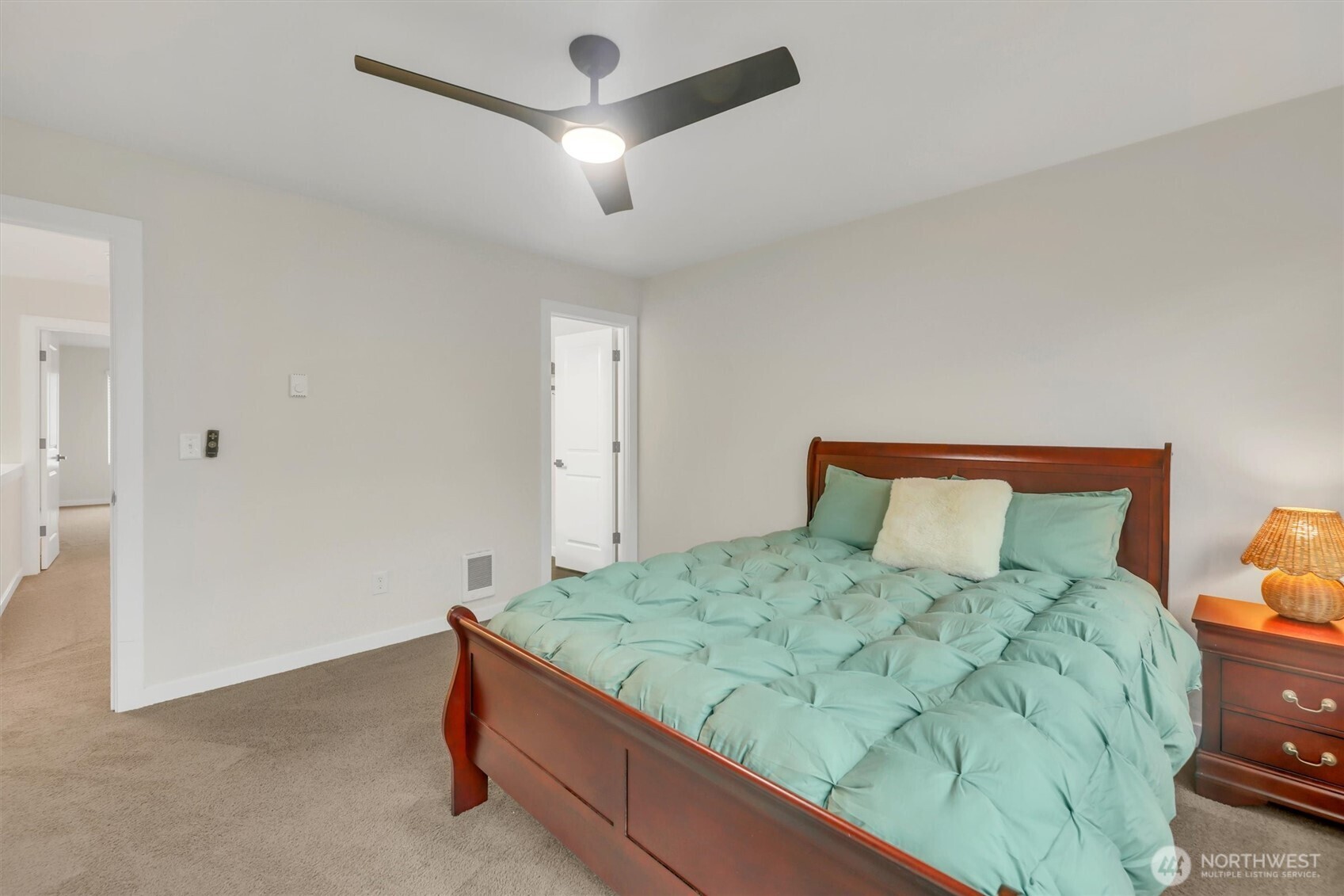 2010 129th Place Southwest, Unit E Everett, WA 98204 - Photo 16 of 37 a bedroom with a bed and a chandelier