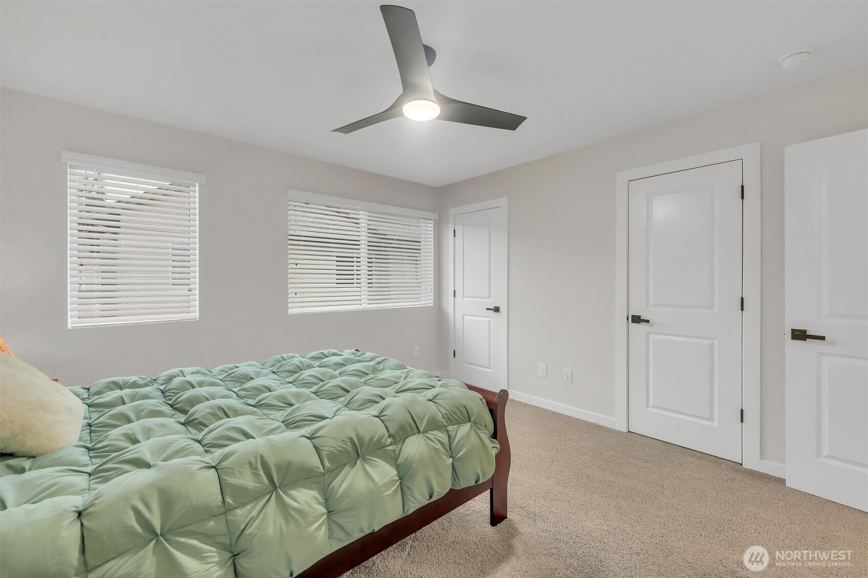 2010 129th Place Southwest, Unit E Everett, WA 98204 - Photo 17 of 37 a bedroom with a bed and a window