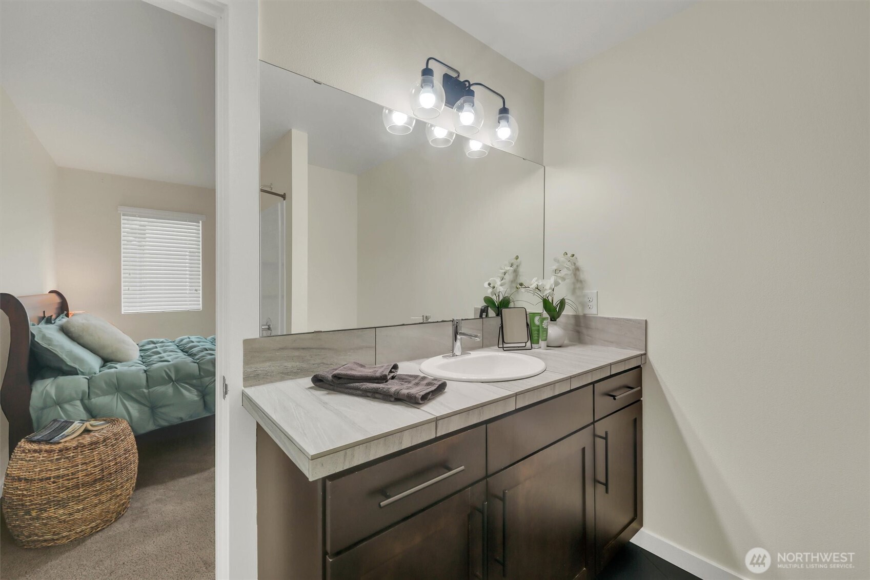 2010 129th Place Southwest, Unit E Everett, WA 98204 - Photo 18 of 37 a bathroom with a sink and a mirror