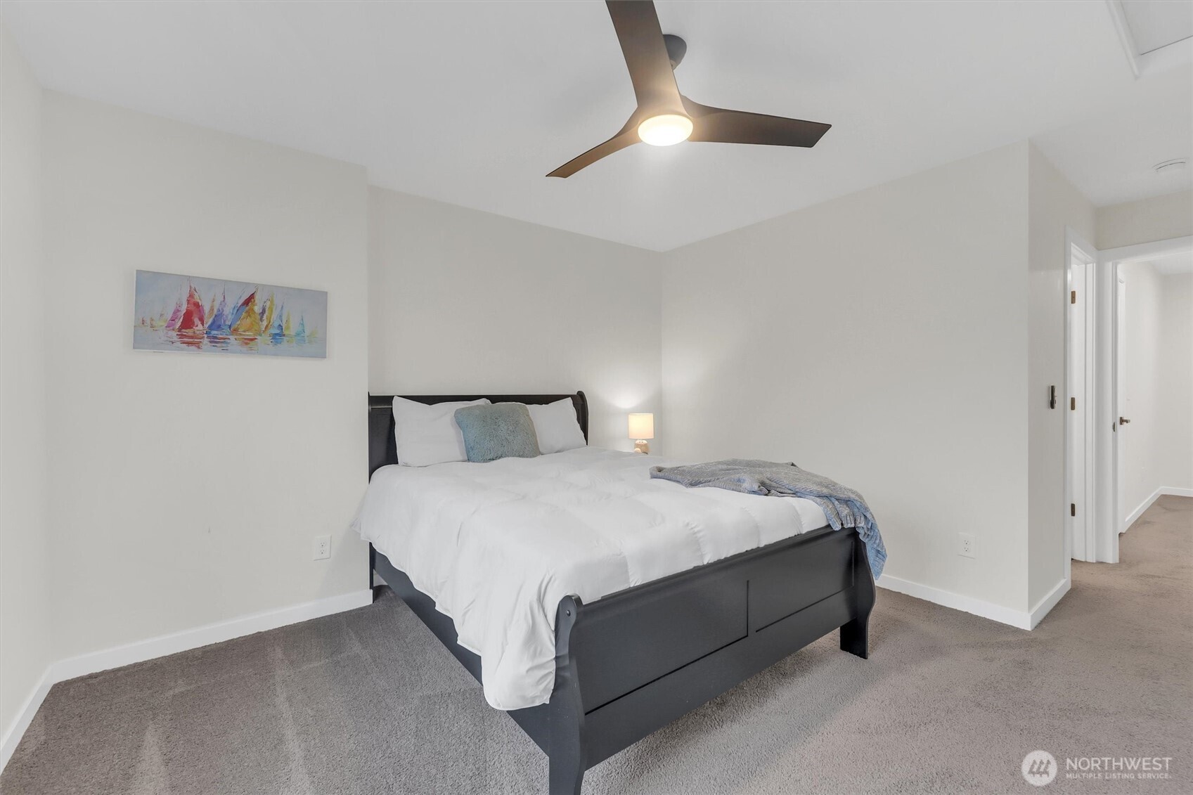 2010 129th Place Southwest, Unit E Everett, WA 98204 - Photo 23 of 37 a bedroom with a bed and a ceiling fan