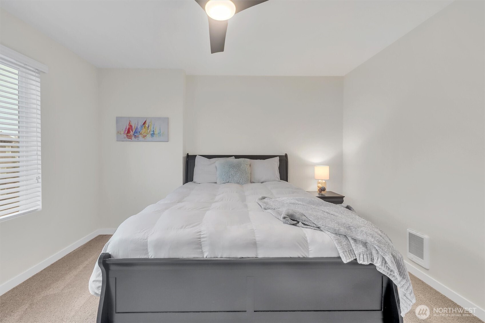 2010 129th Place Southwest, Unit E Everett, WA 98204 - Photo 25 of 37 a bedroom with a bed and a chandelier