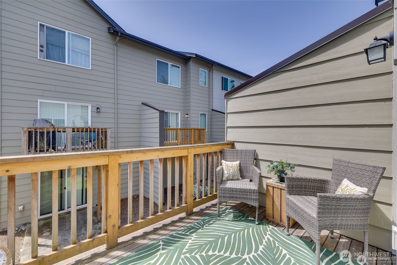 2010 129th Place Southwest, Unit E Everett, WA 98204 - Photo 32 of 37 a view of a chair and tables in the balcony