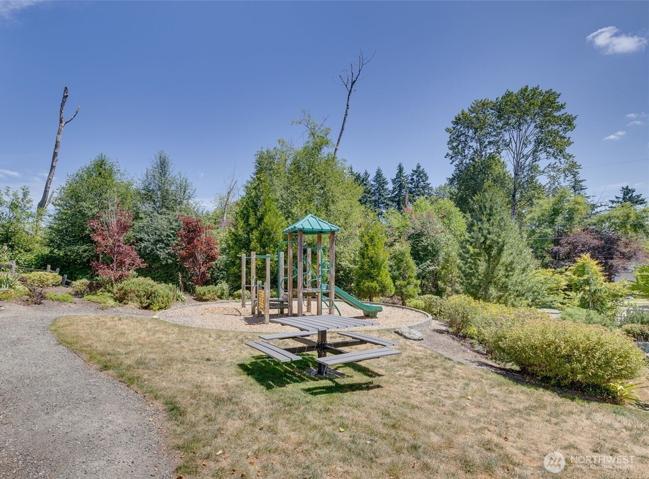 2010 129th Place Southwest, Unit E Everett, WA 98204 - Photo 36 of 37 a view of a park with plants and trees