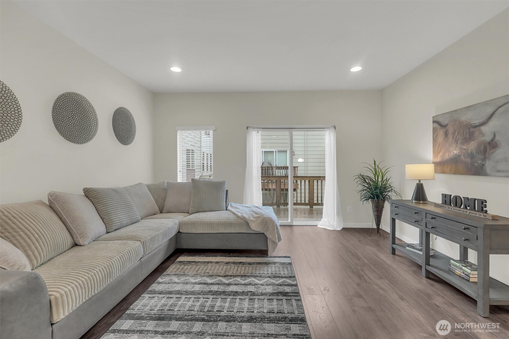 2010 129th Place Southwest, Unit E Everett, WA 98204 - Photo 6 of 37 a living room with furniture and a wooden floor