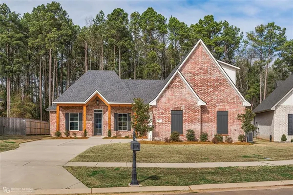 front view of a house and a yard
