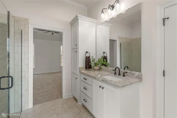 a bathroom with a double vanity sink and a mirror