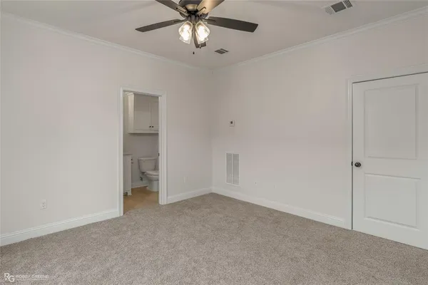 an empty room with a empty space and a ceiling fan