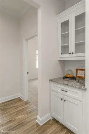 a view of cabinets and wooden floor