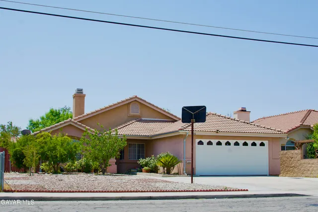 a view of a house with a street